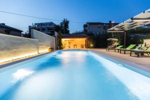 a swimming pool in the backyard of a house at Villa Oria in Pula