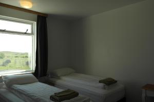 Katil atau katil-katil dalam bilik di Eidavellir Apartments and Rooms
