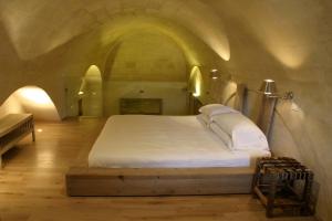 Voodi või voodid majutusasutuse L'Hotel In Pietra toas