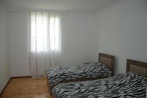 Letto o letti in una camera di Gogi Jafaridze's Guesthouse