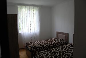 Letto o letti in una camera di Gogi Jafaridze's Guesthouse