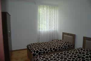 Letto o letti in una camera di Gogi Jafaridze's Guesthouse