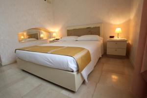 Postel nebo postele na pokoji v ubytování Hotel Europa