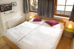 Un pat sau paturi într-o cameră la Flatscherbauer