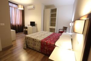 Postel nebo postele na pokoji v ubytování Hotel Europa