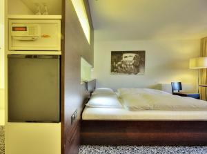 Postel nebo postele na pokoji v ubytování Geniesserhotel Rauter