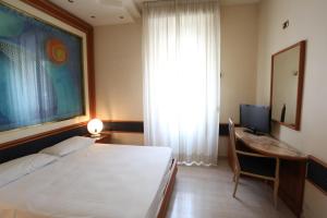 Postel nebo postele na pokoji v ubytování Hotel Europa