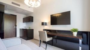 Televízia a/alebo spoločenská miestnosť v ubytovaní VacationClub - Diune Apartment 231