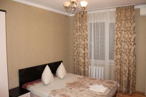 Ένα ή περισσότερα κρεβάτια σε δωμάτιο στο Apartment on Lenina
