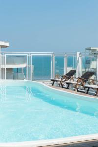Bazén v ubytovaní Perla Verde Hotel alebo v jeho blízkosti