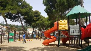 a playground with a slide in a park at Prince Apartment in Vasto