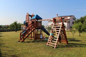 a group of children playing on a playground at Villa Kimberly in Rovinj