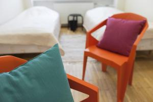 Rúm í herbergi á EHE Hostel