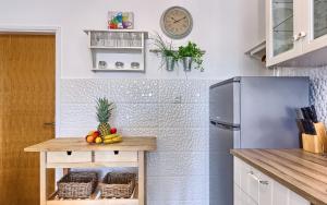 Kuchyň nebo kuchyňský kout v ubytování Lantana Apartment