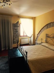 Un pat sau paturi într-o cameră la B&B La Dimora del Capitano