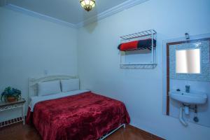 Postel nebo postele na pokoji v ubytování Hotel Zaitoune