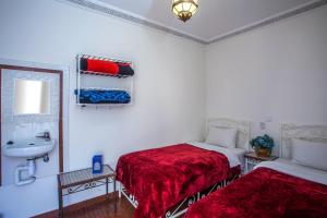 Postel nebo postele na pokoji v ubytování Hotel Zaitoune