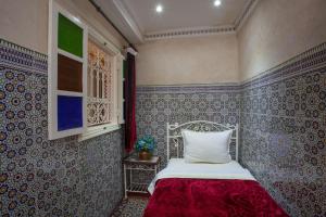 Postel nebo postele na pokoji v ubytování Hotel Zaitoune