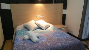Postel nebo postele na pokoji v ubytování Hostal Lima