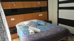 Postel nebo postele na pokoji v ubytování Hostal Lima