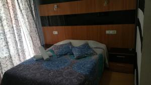 Postel nebo postele na pokoji v ubytování Hostal Lima