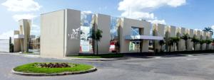 a large building with a street in front of it at Mara Turismo Hotel in Catalão