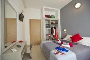 Postel nebo postele na pokoji v ubytování Hotel Sabrina Rimini