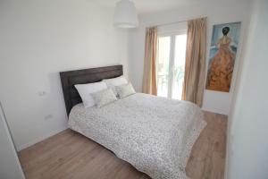 Ένα ή περισσότερα κρεβάτια σε δωμάτιο στο Villa Luce del Sole