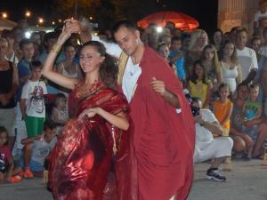 a man and a woman dancing in front of a crowd at Apartment D & N in Kaštela