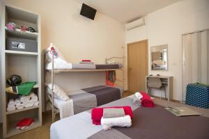 Postel nebo postele na pokoji v ubytování Hotel Sabrina Rimini