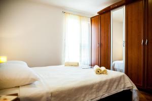 Posteľ alebo postele v izbe v ubytovaní La Mia Apartment