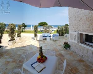 a patio with a table with fruit on it at Case Vacanza Marzano in Monopoli
