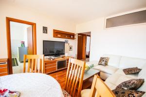 Televízia a/alebo spoločenská miestnosť v ubytovaní La Mia Apartment