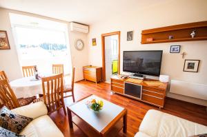 Televízia a/alebo spoločenská miestnosť v ubytovaní La Mia Apartment