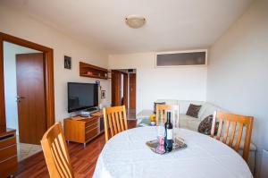 Televízia a/alebo spoločenská miestnosť v ubytovaní La Mia Apartment