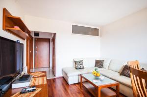 Televízia a/alebo spoločenská miestnosť v ubytovaní La Mia Apartment