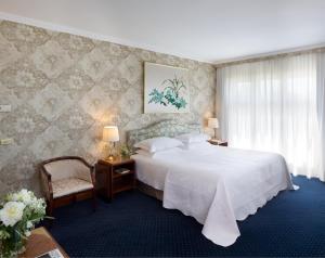 Postel nebo postele na pokoji v ubytování Starhotels Du Parc