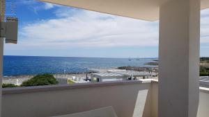 a view of the ocean from a balcony at Case Vacanza Marzano in Monopoli