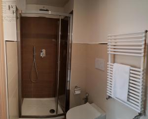 a bathroom with a shower and a toilet at Case Vacanza Marzano in Monopoli