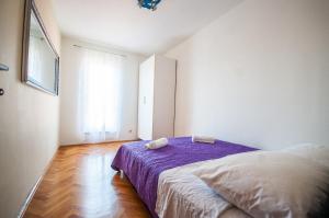 Posteľ alebo postele v izbe v ubytovaní La Mia Apartment