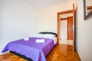 Posteľ alebo postele v izbe v ubytovaní La Mia Apartment