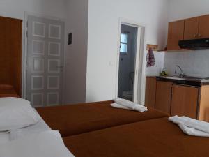 Postel nebo postele na pokoji v ubytování Studios Evdokia