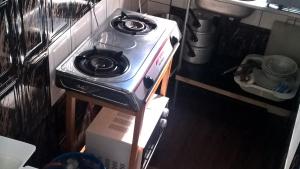 a stove top oven sitting in a kitchen at Furnished self-catering guest wing in Lusaka