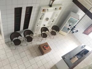an overhead view of a kitchen with chairs and a table at Hotel Pousada Farol da Praia in São Luís