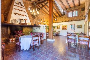 a dining room with tables and chairs in a building at Agroturisme Ca'n Gaia in Portocolom