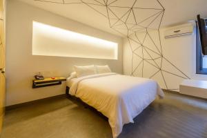 Ένα ή περισσότερα κρεβάτια σε δωμάτιο στο Hotel El Peñon by Bithotels