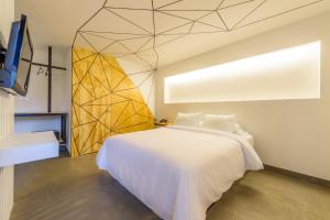 Μια τηλεόραση ή/και κέντρο ψυχαγωγίας στο Hotel El Peñon by Bithotels