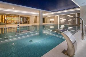 a large swimming pool in a house with a swimming pool at ESTIMAR Calpe Suitopia in Calpe