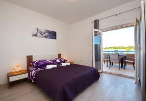 Postel nebo postele na pokoji v ubytování Apartments Clara