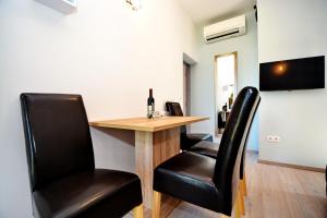 TV a/nebo společenská místnost v ubytování Apartments Clara